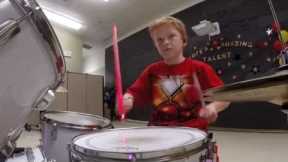 Iron Man 10 year old drumming. Starts at 3:35