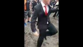 Guy looks out of place wearing a suit to a festival, until the beat drops | CONTENTbible