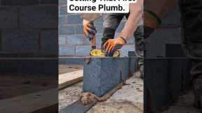 Level across the top of your block to make your wall go up straight #bricklayer #work #tips